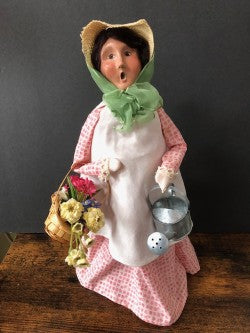 Gardening Lady in Pink with with basket and wateringcan