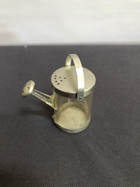 watering can with clear base and metal trim