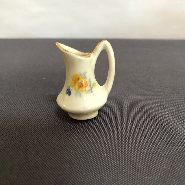 ceramic pitcdher with yellow flowers