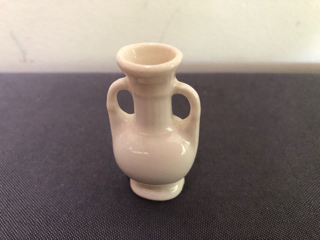 white ceramic two handle vase