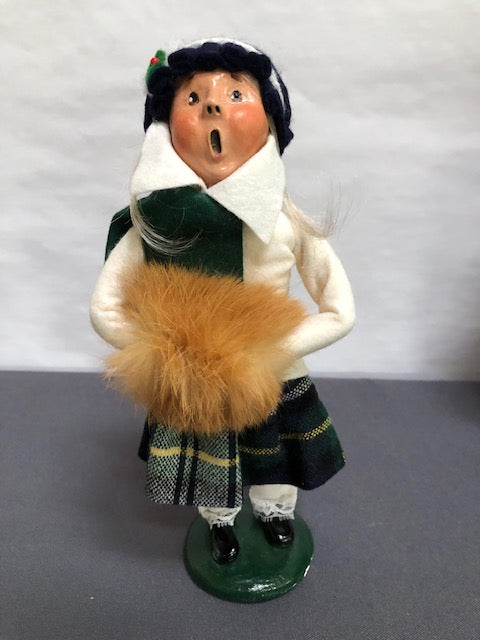 Girl in white and green plaid with tan fur muff