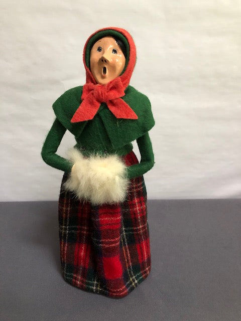 Lady in green with red plaid & white fur muff