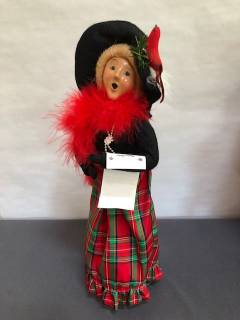 Lady in black & red plaid with cardinal on hat