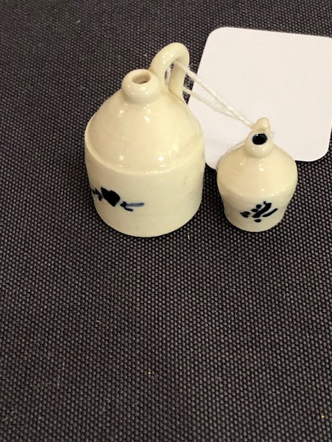 two white & blue crockery jugs