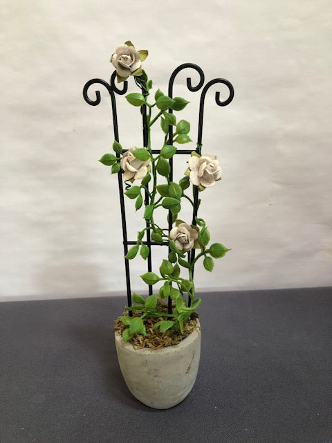 grey rose trellis in round concrete pot