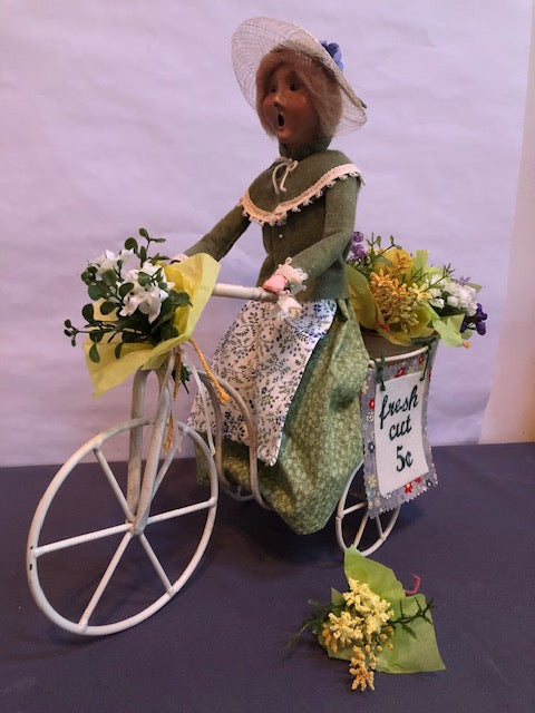 Fresh cut flower lady on bike (Redressed Caroler)