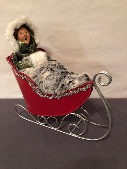 Lady in Red and Silver Sleigh with fur blanket  (Redressed Caroler)