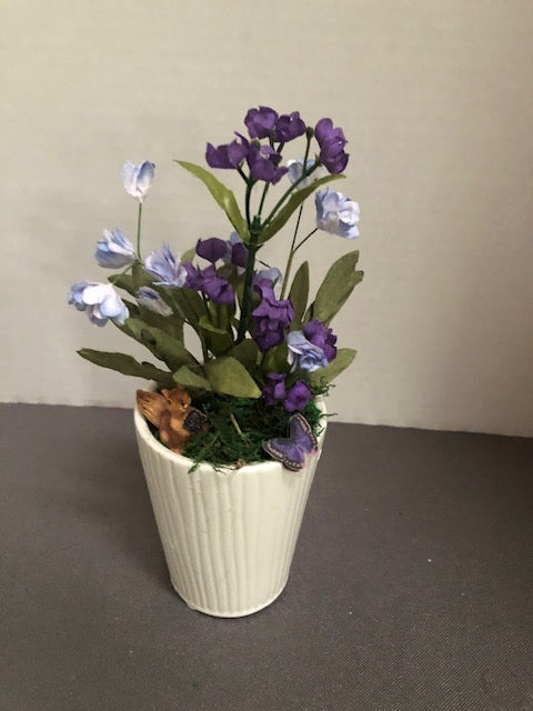 Purple Flowers in White Ceramic Planter