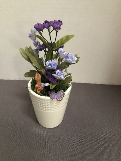 Purple Flowers in White Ceramic Planter